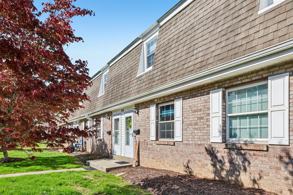 239 Whitestown Village, Unit F Butler, PA 16001 - Photo 4 of 40 a front view of a house with a yard