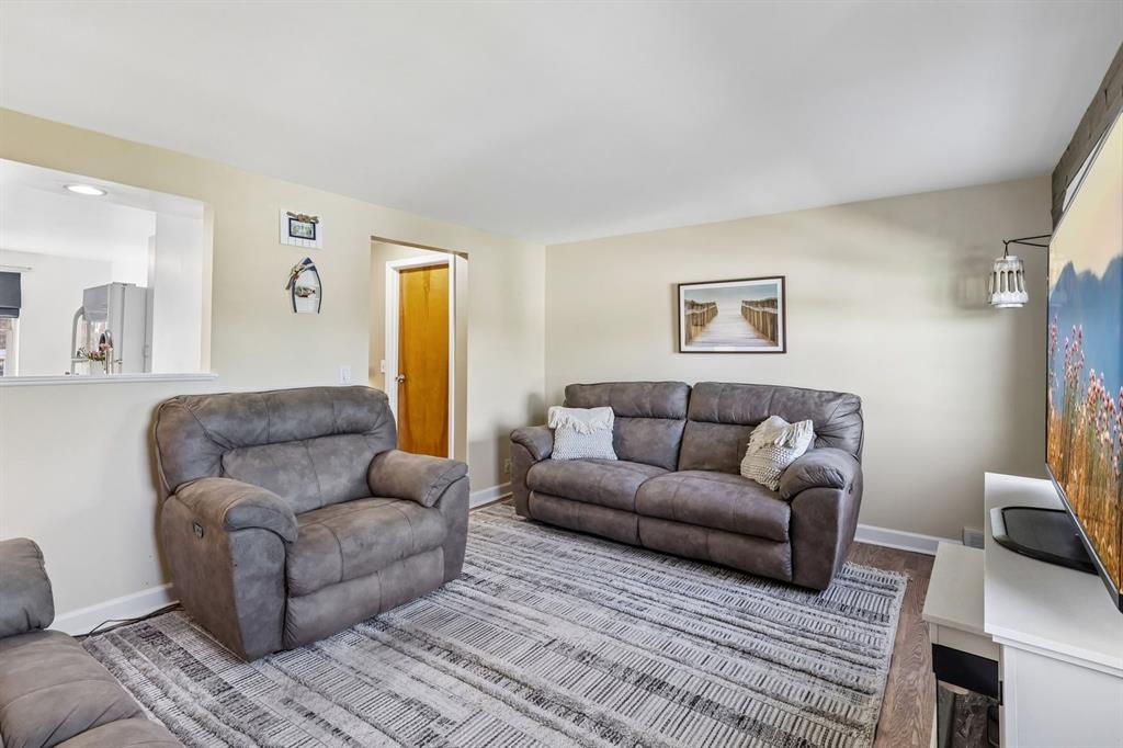 239 Whitestown Village, Unit F Butler, PA 16001 - Photo 8 of 40 a living room with furniture and a couch