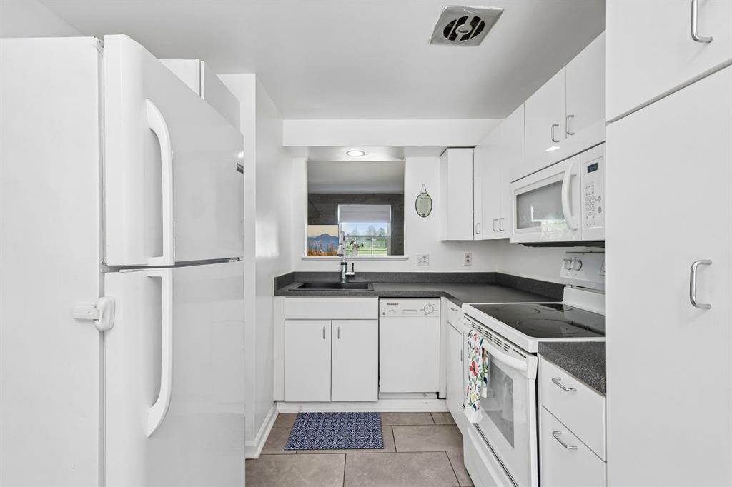 239 Whitestown Village, Unit F Butler, PA 16001 - Photo 10 of 40 a kitchen with a sink stove and refrigerator