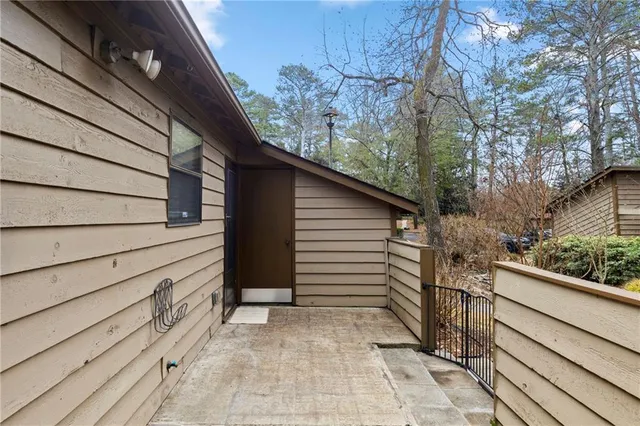 a view of a house with a large trees