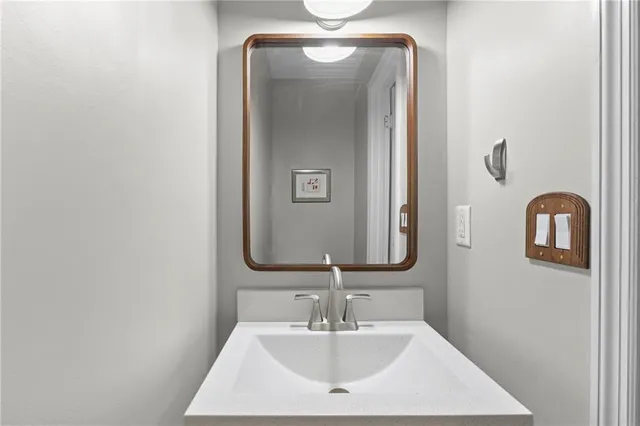 a bathroom with a sink and a mirror