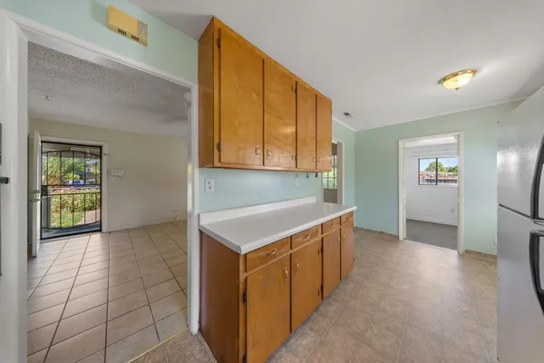 a kitchen with a sink and a refrigerator