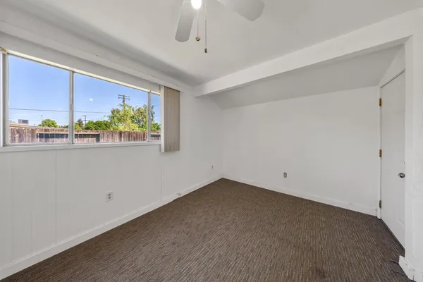 a view of room with window and stairs