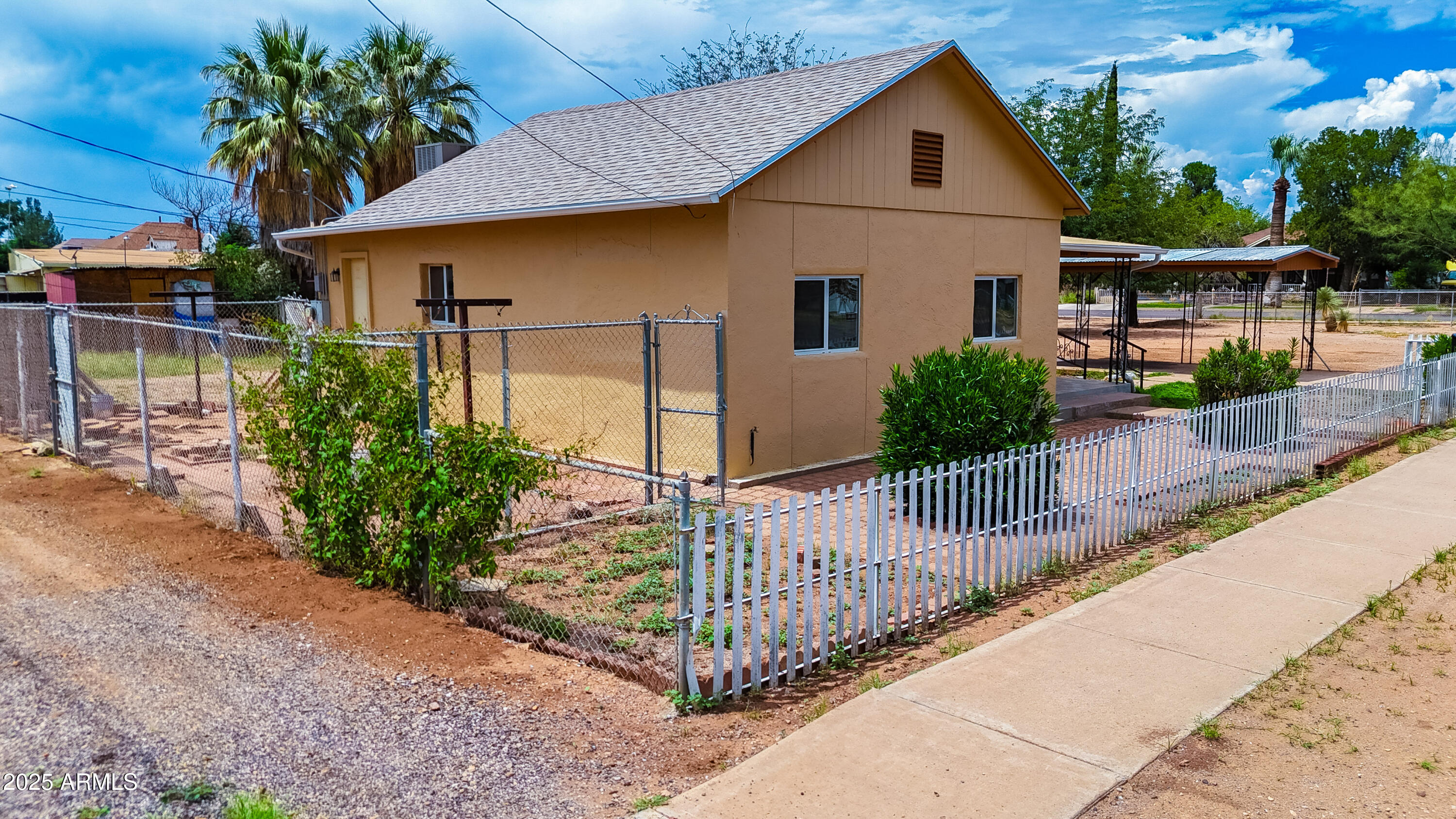 660 B Avenue Douglas, AZ 85607 - Photo 26 of 32 a front view of a house with garden