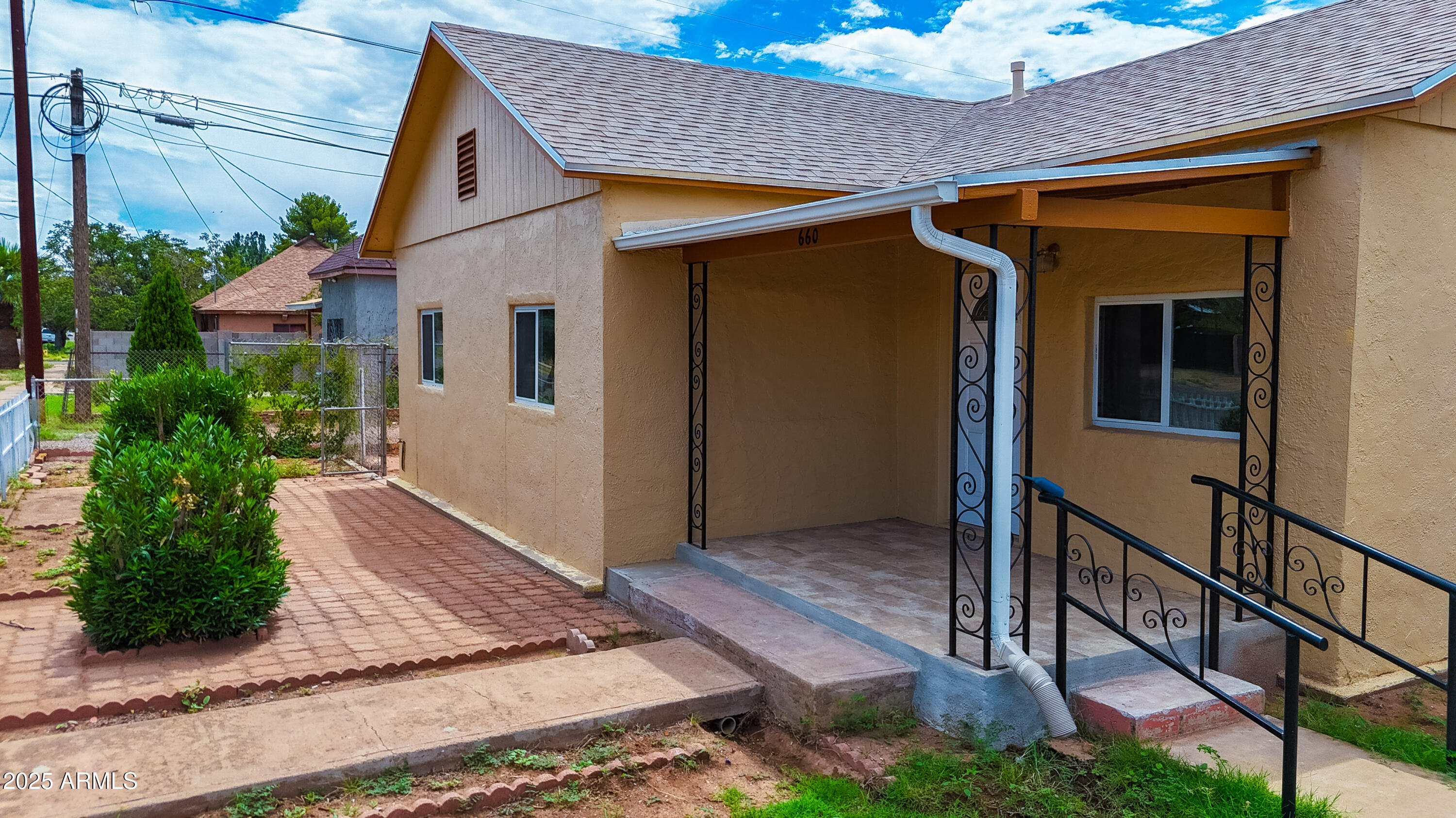 660 B Avenue Douglas, AZ 85607 - Photo 3 of 32 a front view of a house with garden