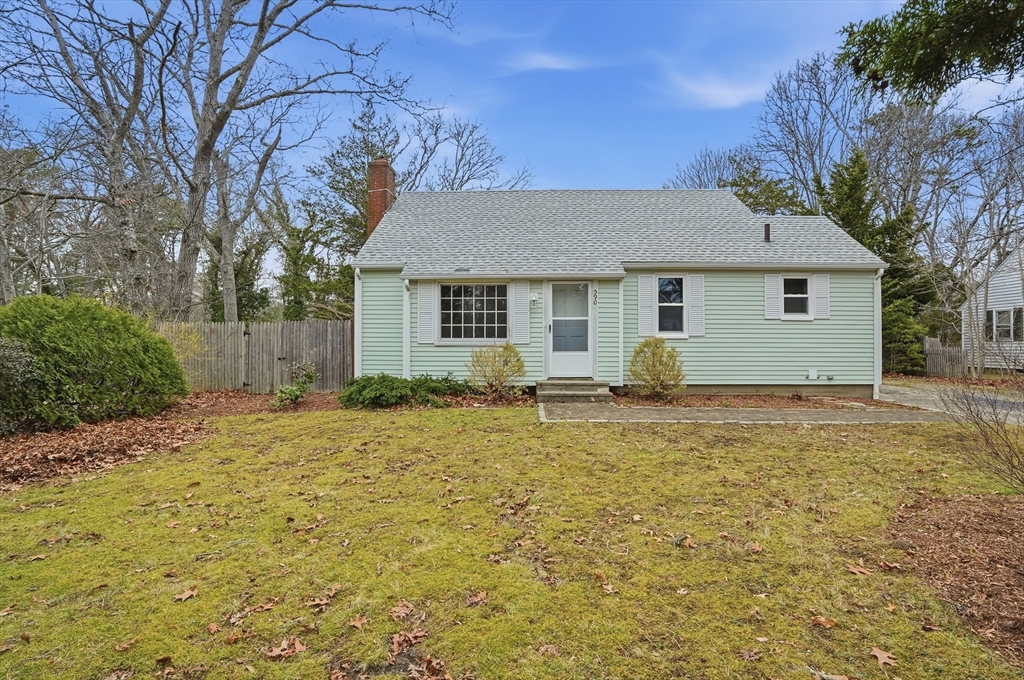 590 Sandwich Road Falmouth, MA 02536 - Photo 1 of 42 a house view with a backyard space