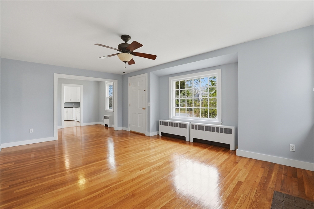 590 Sandwich Road Falmouth, MA 02536 - Photo 17 of 42 a view of empty room with wooden floor and fan
