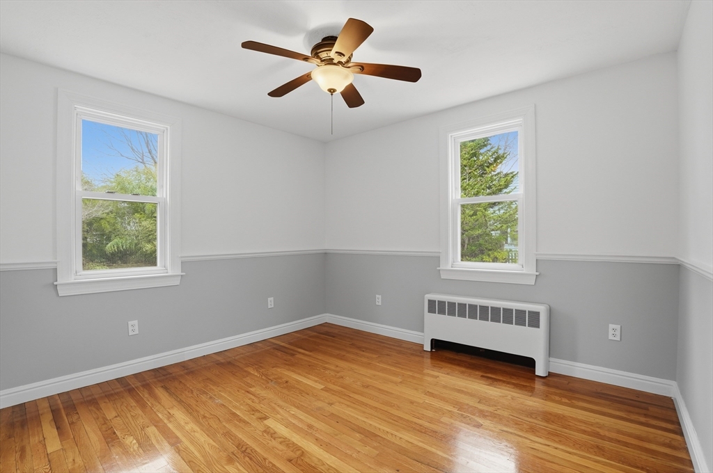 590 Sandwich Road Falmouth, MA 02536 - Photo 21 of 42 wooden floor in an empty room with a window