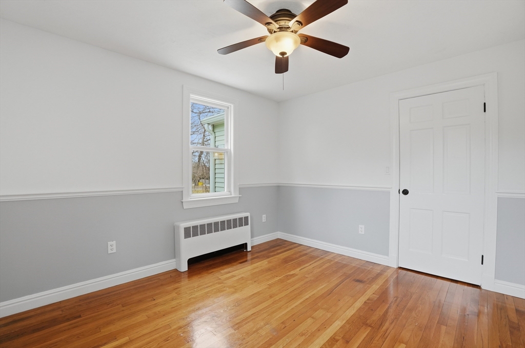 590 Sandwich Road Falmouth, MA 02536 - Photo 22 of 42 wooden floor in an empty room with a window
