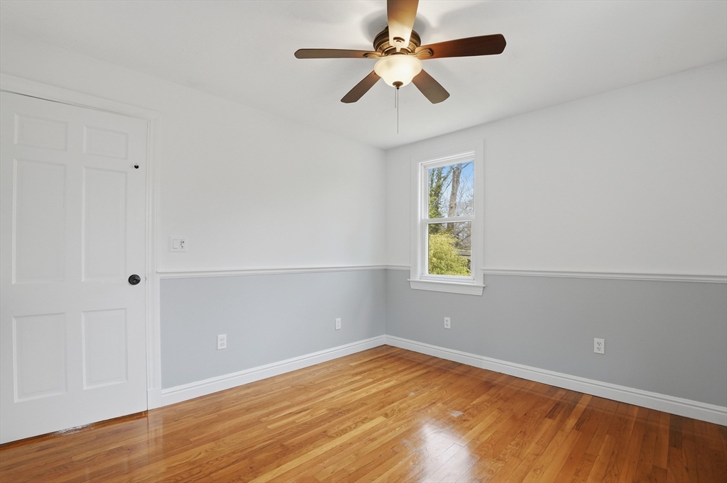 590 Sandwich Road Falmouth, MA 02536 - Photo 24 of 42 an empty room with a window and a ceiling fan
