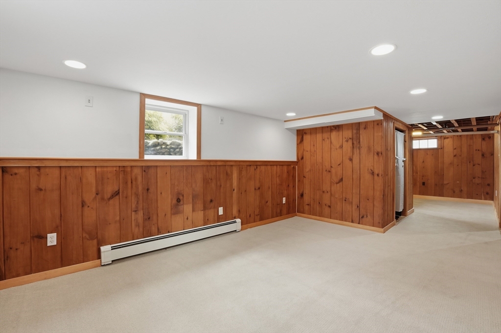 590 Sandwich Road Falmouth, MA 02536 - Photo 33 of 42 an empty room with a wooden walls