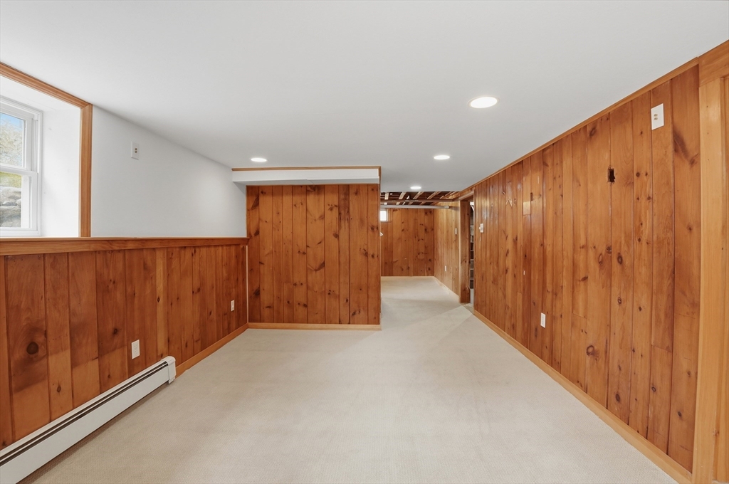 590 Sandwich Road Falmouth, MA 02536 - Photo 36 of 42 a view of an empty room with wooden walls