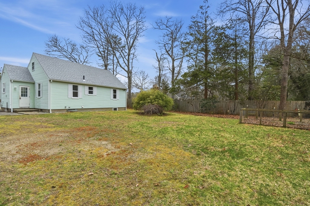 590 Sandwich Road Falmouth, MA 02536 - Photo 38 of 42 a view of a house with a yard