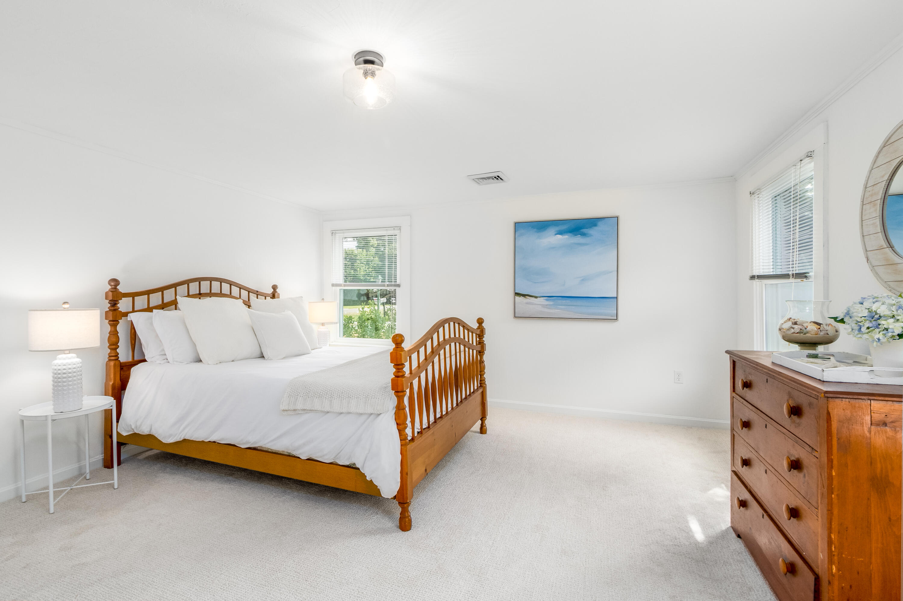 429 Paine's Creek Road Brewster, MA 02631 - Photo 17 of 35 a bedroom with a bed and a lamp with the dresser