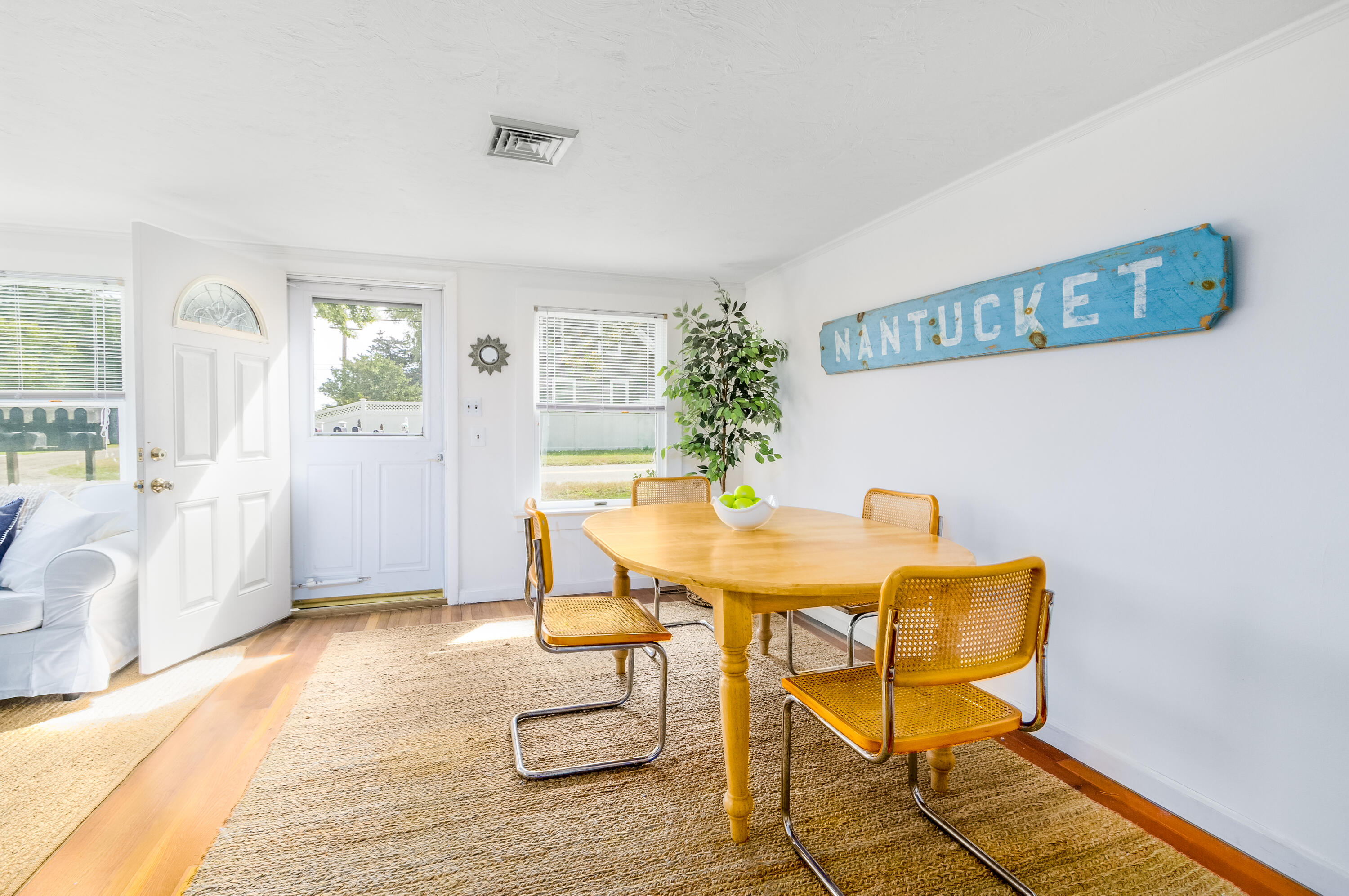 429 Paine's Creek Road Brewster, MA 02631 - Photo 5 of 35 a view of a dining room with furniture and wooden floor