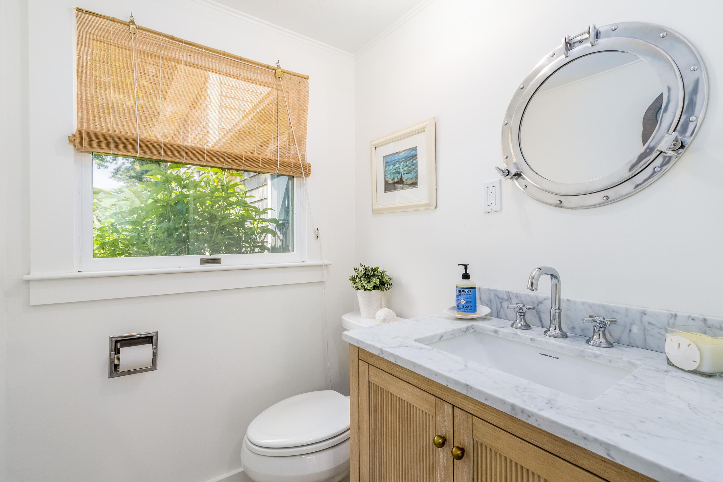 429 Paine's Creek Road Brewster, MA 02631 - Photo 6 of 35 a bathroom with a granite countertop toilet a sink and a mirror
