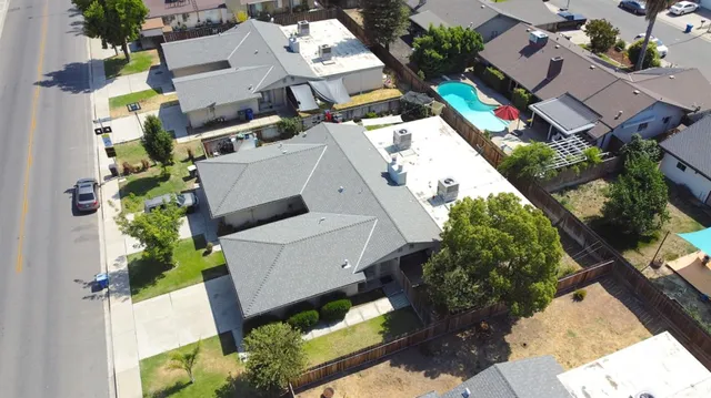 an aerial view of residential house with outdoor space
