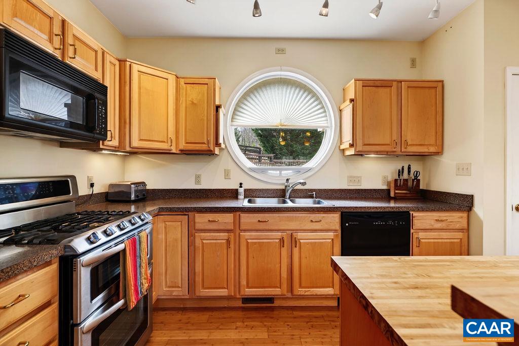 62 Summit Court Roseland, VA 22967 - Photo 12 of 75 a kitchen with stainless steel appliances granite countertop a stove a sink and a microwave