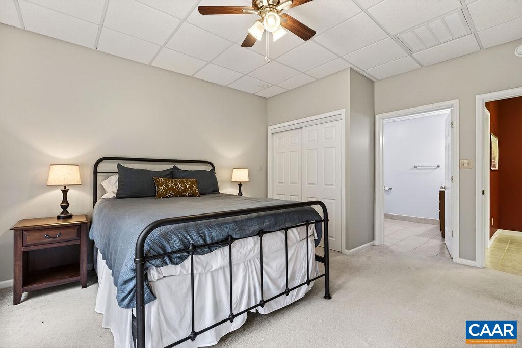 62 Summit Court Roseland, VA 22967 - Photo 50 of 75 a bedroom with a bed and a chandelier