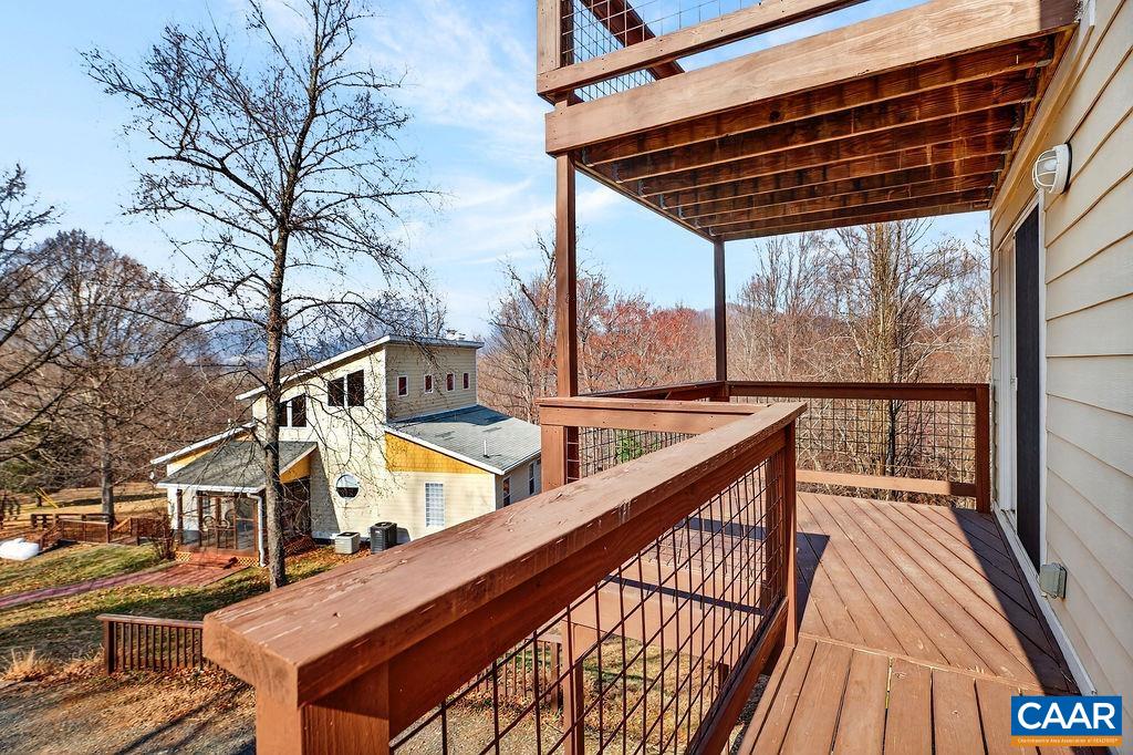 62 Summit Court Roseland, VA 22967 - Photo 64 of 75 a view of balcony with wooden floor and fence