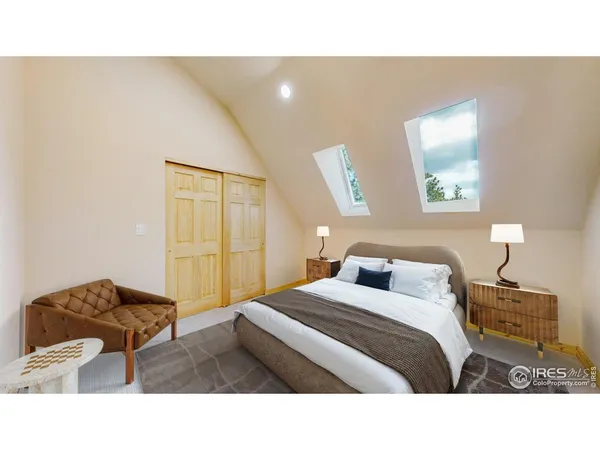 a bedroom with a bed and a lamp