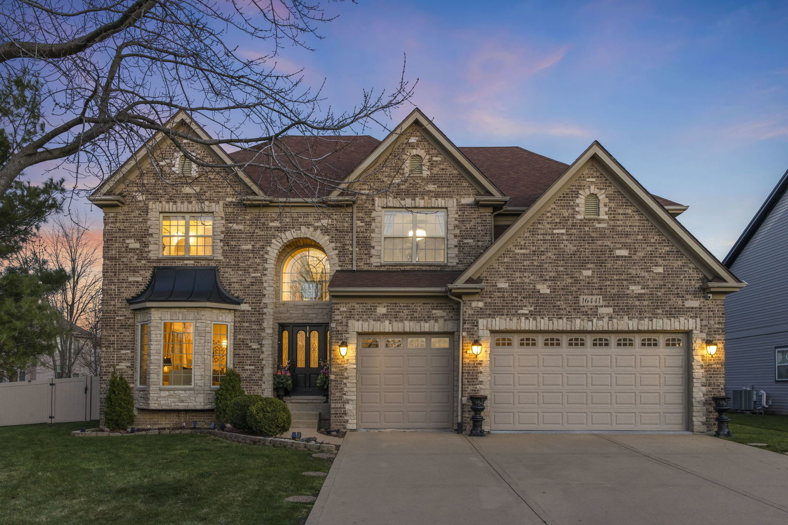 16441 Mueller Circle Plainfield, IL 60586 - Photo 1 of 50 a view of a house with a yard and plants