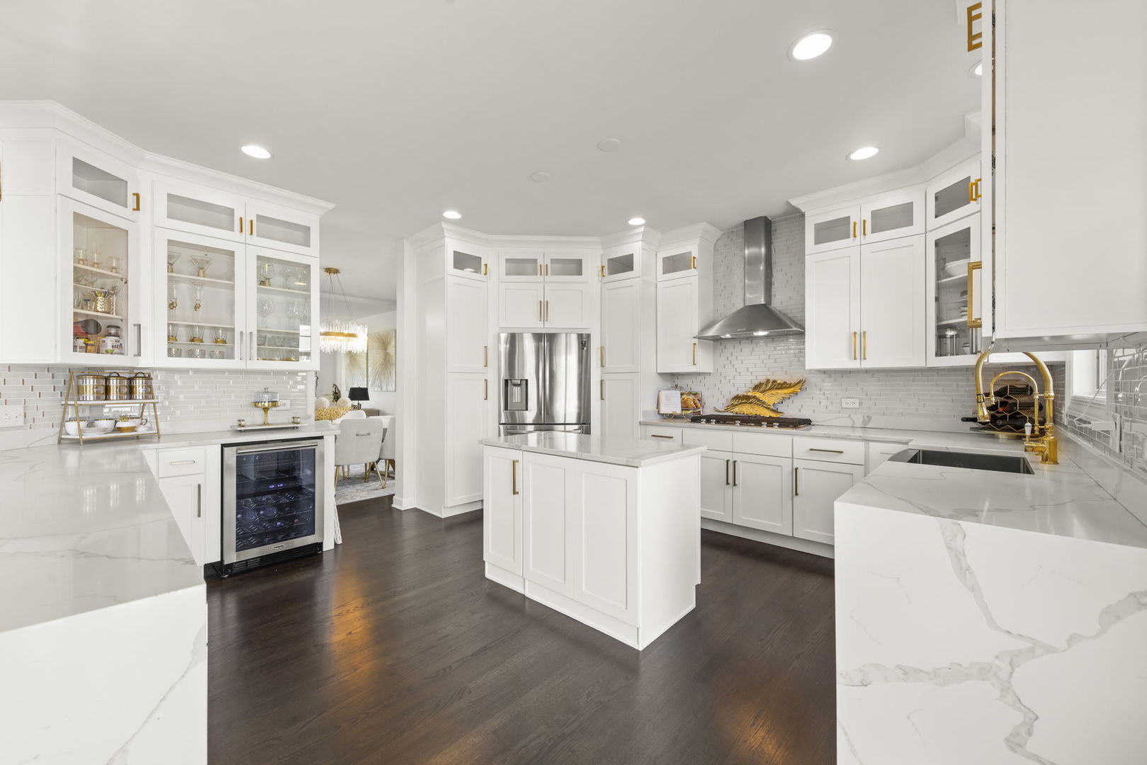 16441 Mueller Circle Plainfield, IL 60586 - Photo 9 of 50 a open kitchen with white cabinets and wooden floor
