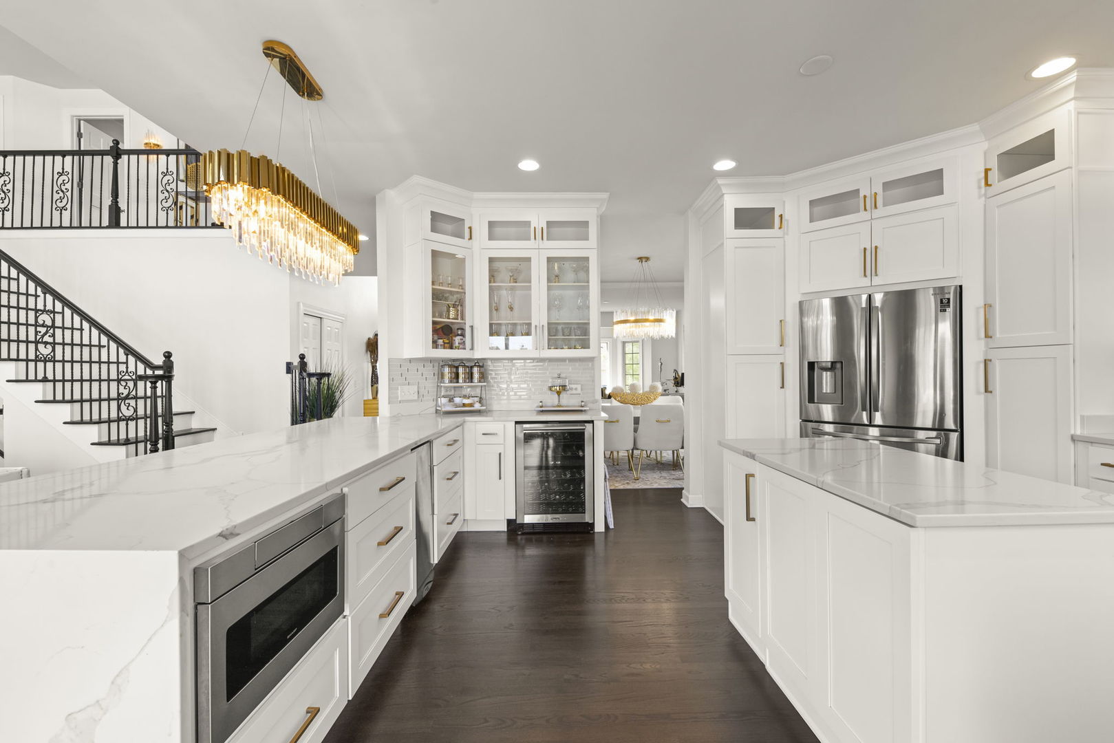 16441 Mueller Circle Plainfield, IL 60586 - Photo 10 of 50 a kitchen with white cabinets and stainless steel appliances