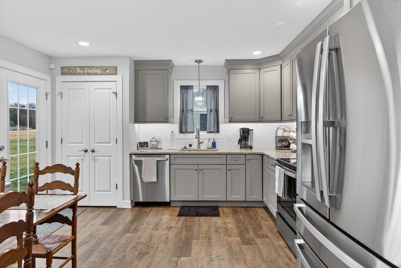 106 16th Street Grottoes, VA 24441 - Photo 11 of 71 a kitchen with a sink refrigerator and cabinets