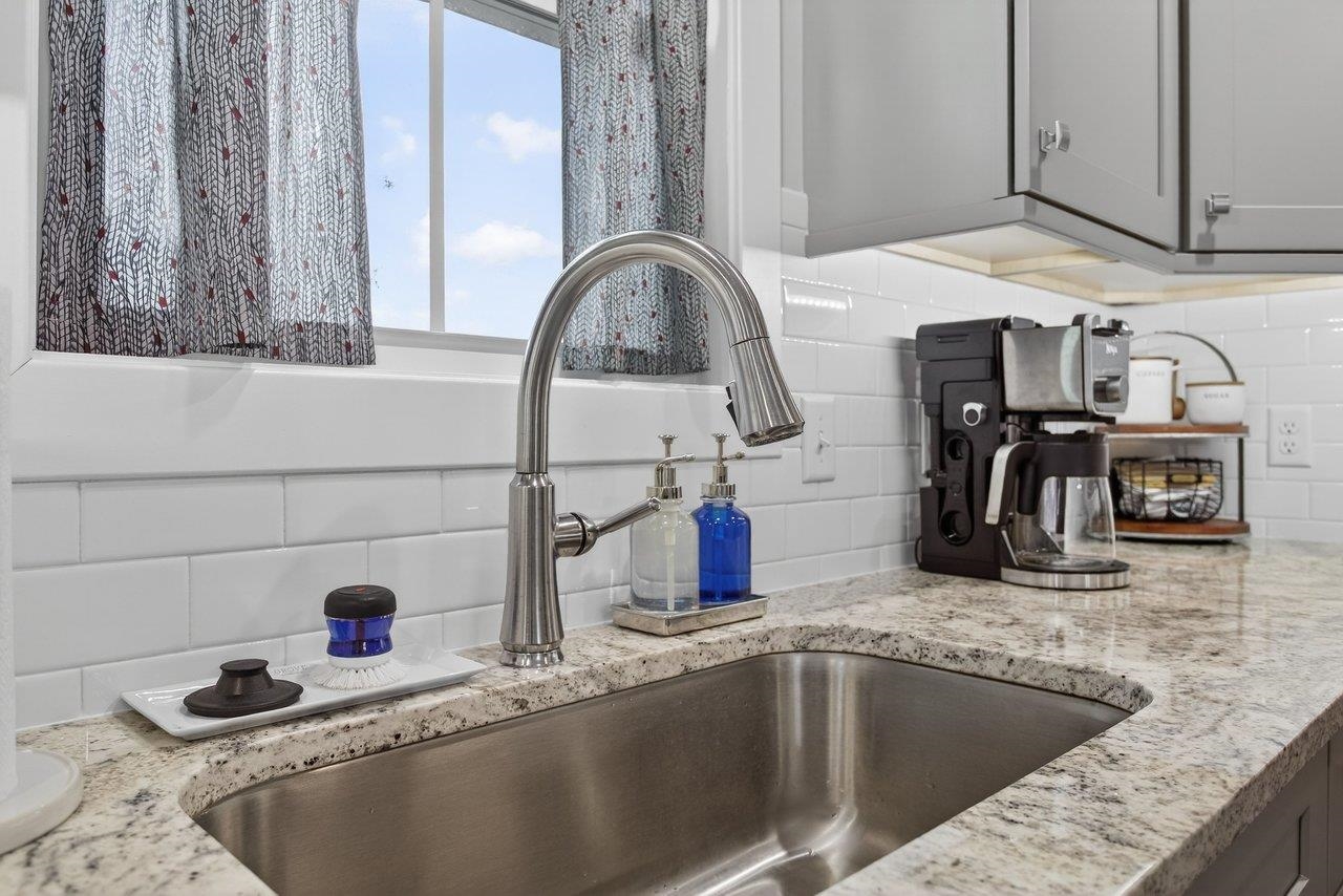 106 16th Street Grottoes, VA 24441 - Photo 14 of 71 a kitchen with kitchen island a sink and a stove
