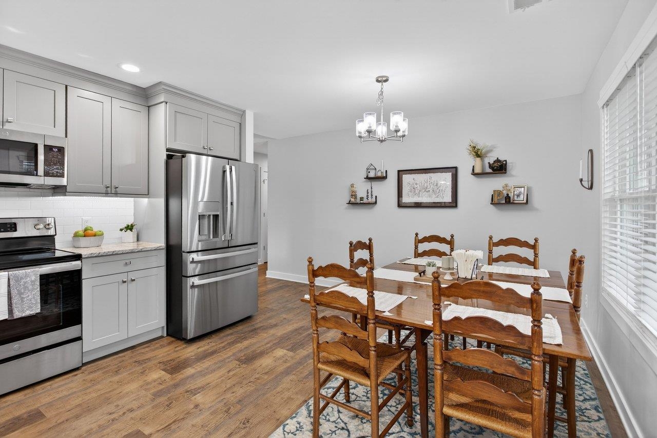 106 16th Street Grottoes, VA 24441 - Photo 16 of 71 a kitchen with granite countertop stainless steel appliances a dining table and chairs