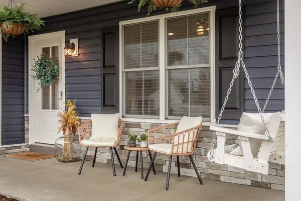 a view of a patio with table and chairs and potted plants
