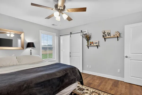 a bedroom with a bed and a dresser