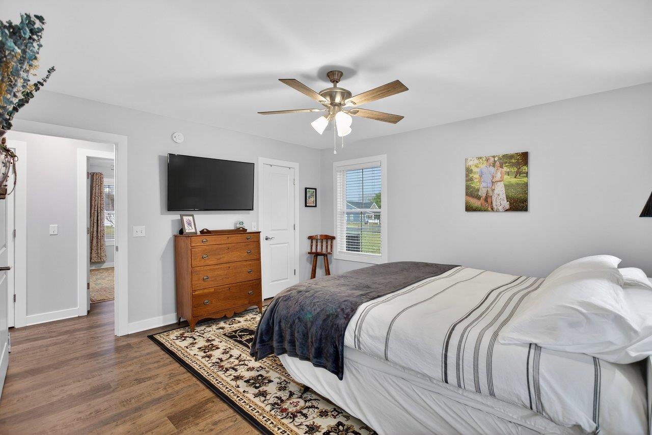 106 16th Street Grottoes, VA 24441 - Photo 22 of 71 a bedroom with a bed and a flat screen tv