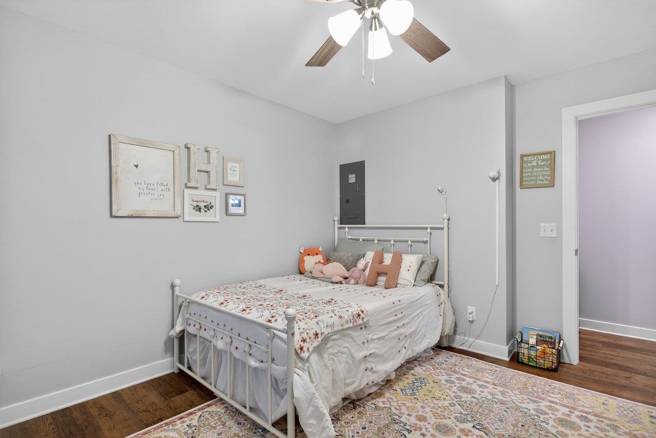 106 16th Street Grottoes, VA 24441 - Photo 27 of 71 a bedroom with a bed and wooden floor