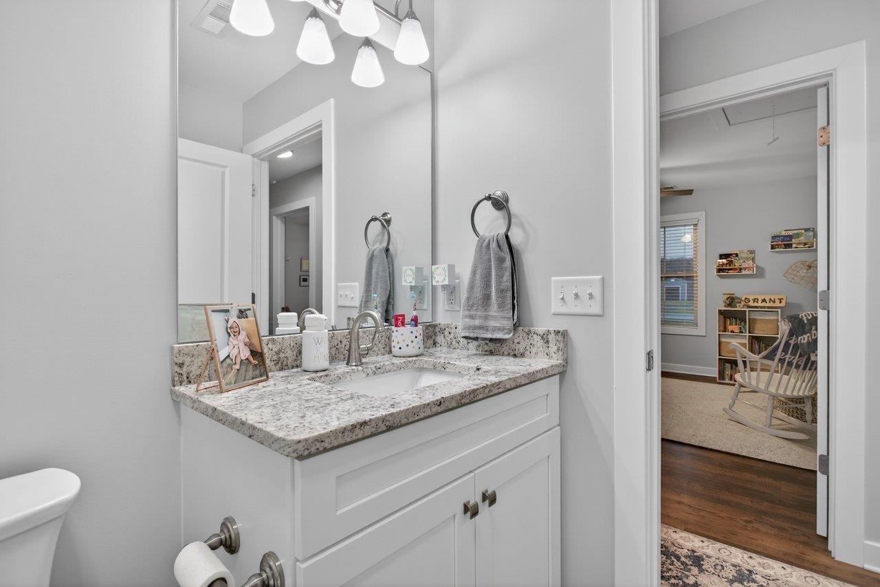 106 16th Street Grottoes, VA 24441 - Photo 32 of 71 a bathroom with a granite countertop sink and a mirror