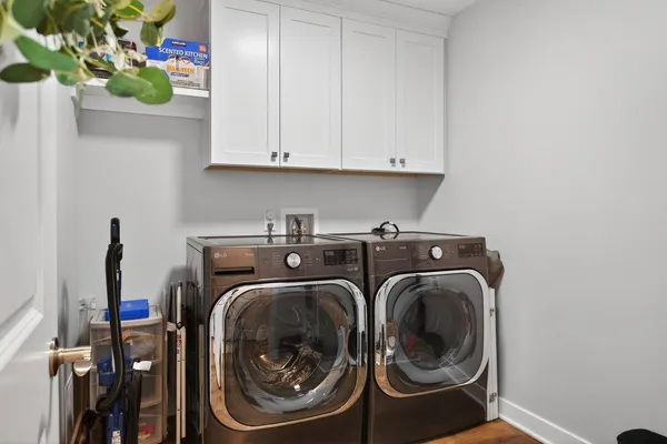 a view of a house with a big yard and large trees