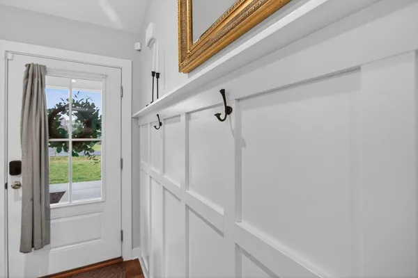 a kitchen with a sink refrigerator and cabinets