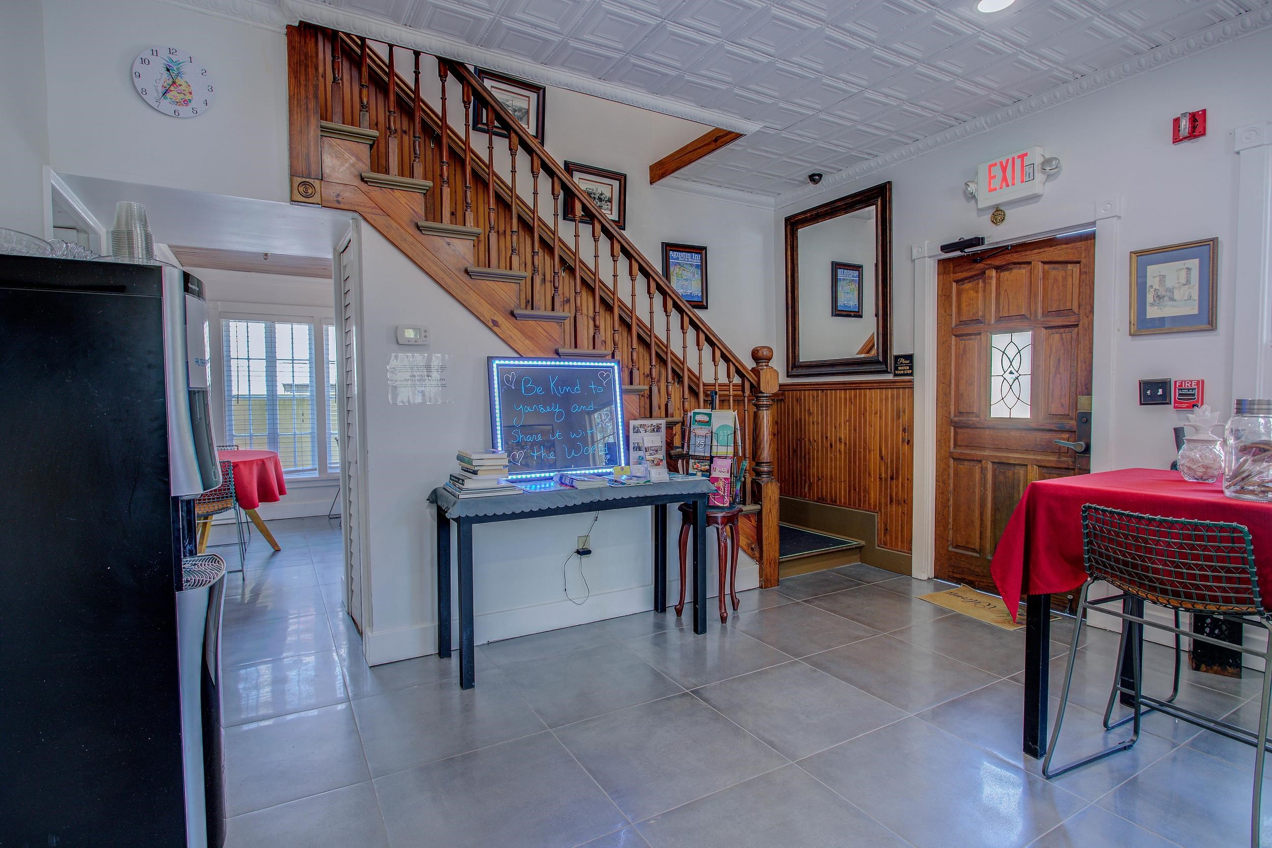 29 Cuna Street St. Augustine, FL 32084 - Photo 17 of 69 Tiled dining area featuring wooden walls, stairs, and an ornate ceiling