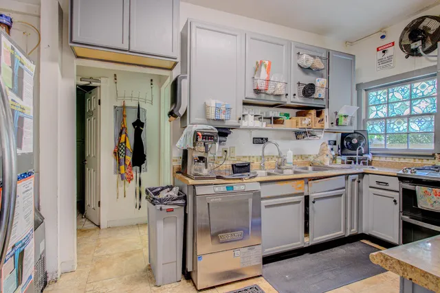 a bedroom with a bed next to a window with the outer view