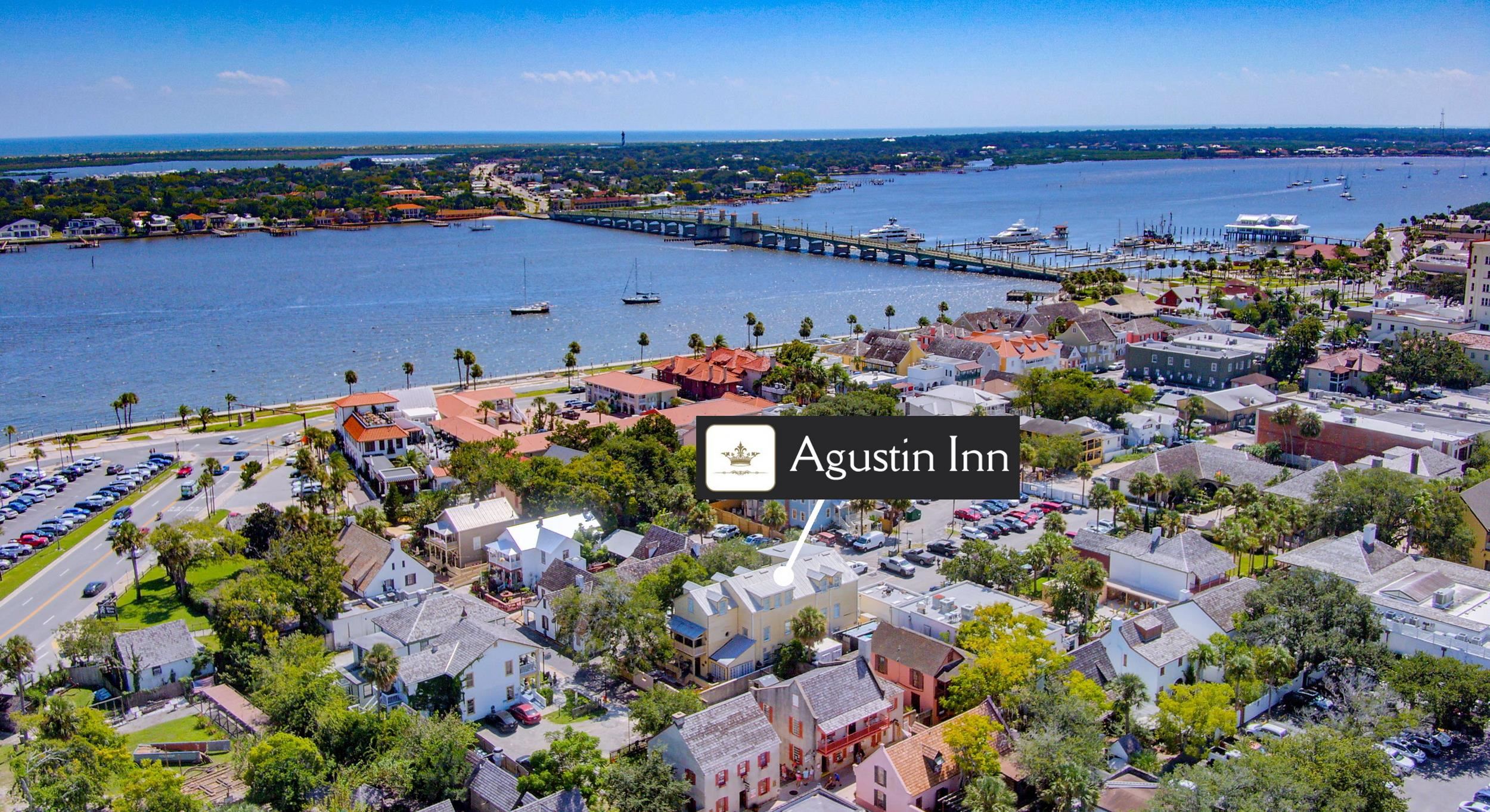 29 Cuna Street St. Augustine, FL 32084 - Photo 2 of 69 Aerial perspective of suburban area featuring a notable bridge and a large body of water