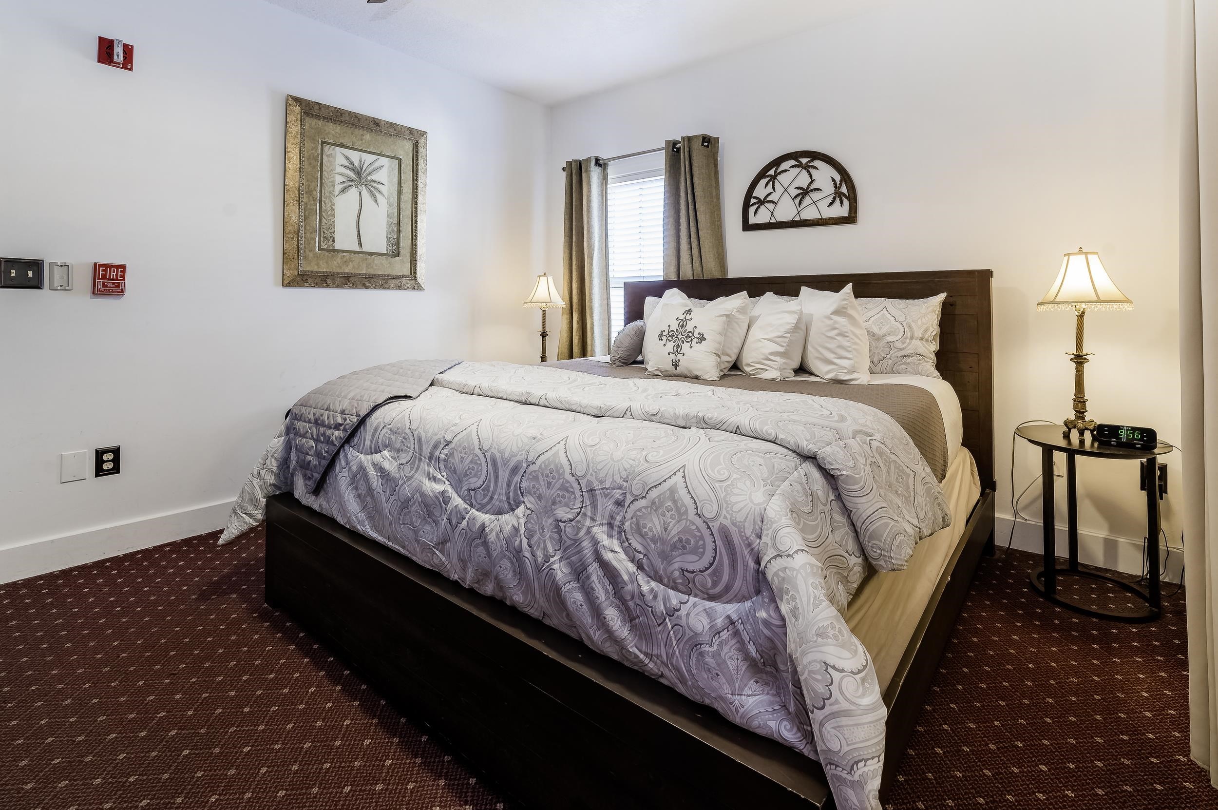 29 Cuna Street St. Augustine, FL 32084 - Photo 21 of 69 Bedroom with dark colored carpet and baseboards