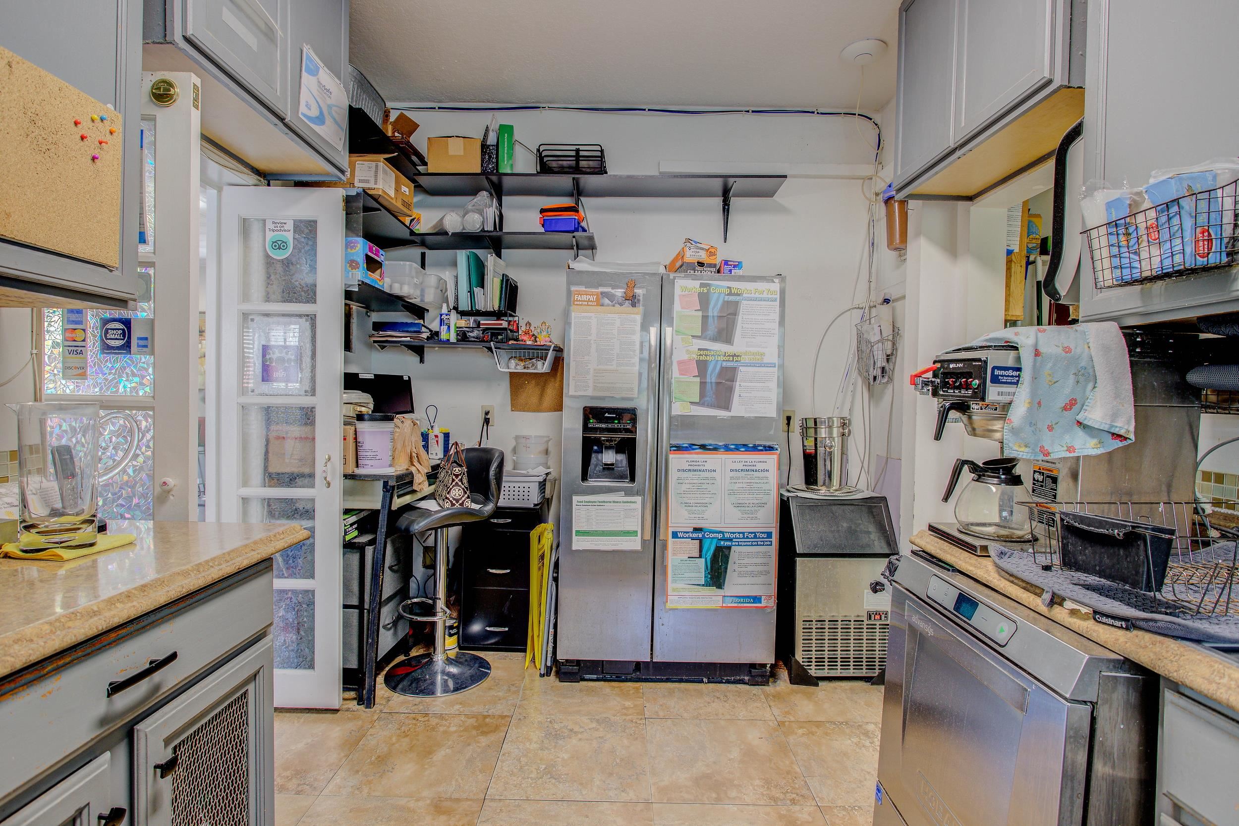 29 Cuna Street St. Augustine, FL 32084 - Photo 23 of 69 a view of a kitchen with fridge and workspace