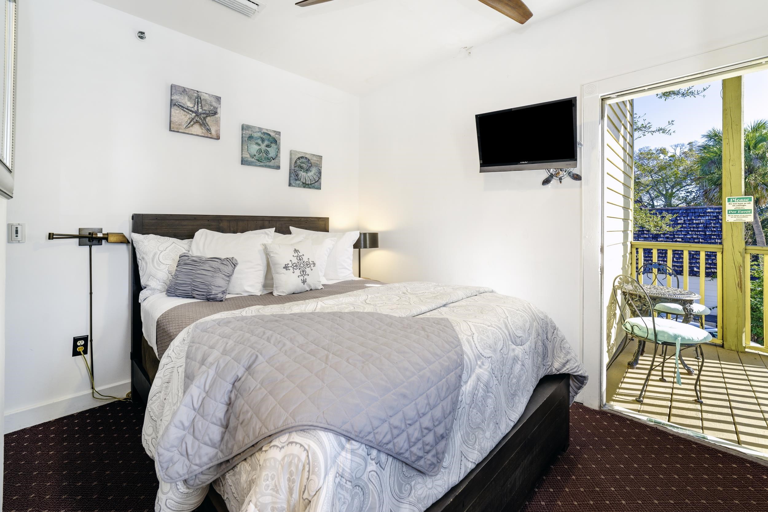 29 Cuna Street St. Augustine, FL 32084 - Photo 24 of 69 Carpeted bedroom with access to exterior and ceiling fan