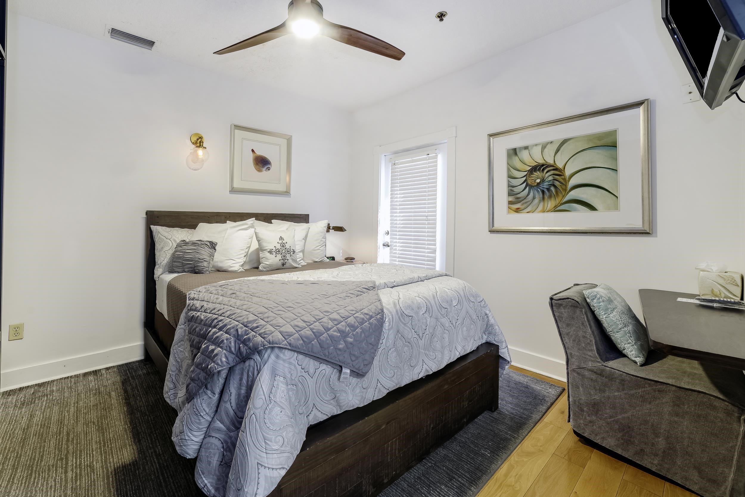 29 Cuna Street St. Augustine, FL 32084 - Photo 27 of 69 a bedroom with a bed and a painting on the wall