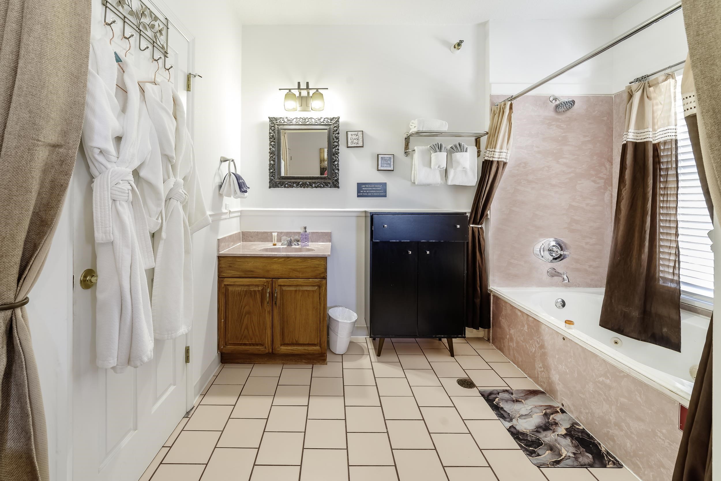 29 Cuna Street St. Augustine, FL 32084 - Photo 30 of 69 a bathroom with a sink a mirror and a bathtub