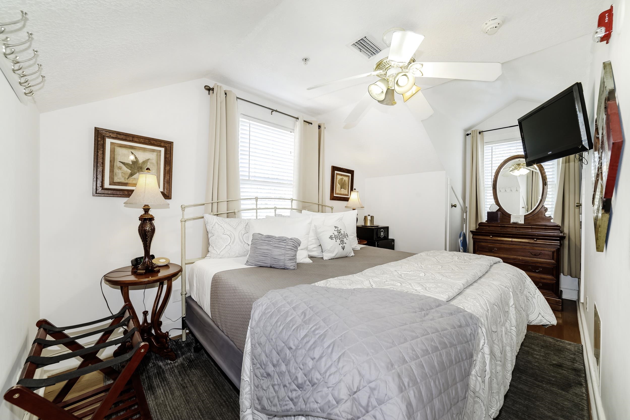 29 Cuna Street St. Augustine, FL 32084 - Photo 33 of 69 a bedroom with a bed and a chandelier