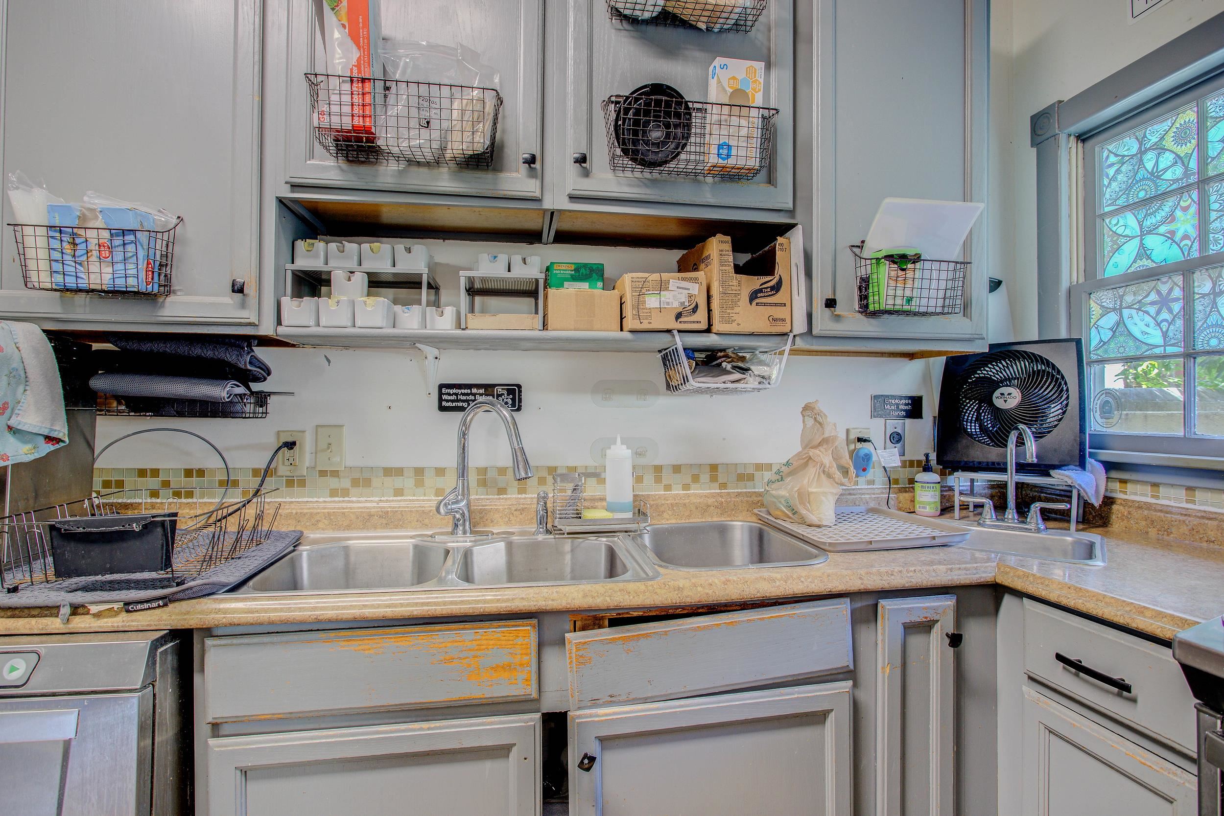29 Cuna Street St. Augustine, FL 32084 - Photo 34 of 69 Kitchen featuring light countertops, white cabinetry, and open shelves