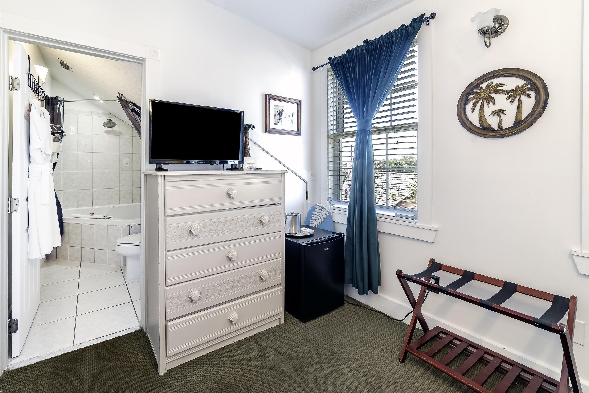 29 Cuna Street St. Augustine, FL 32084 - Photo 41 of 69 a bedroom with a bed and a flat screen tv