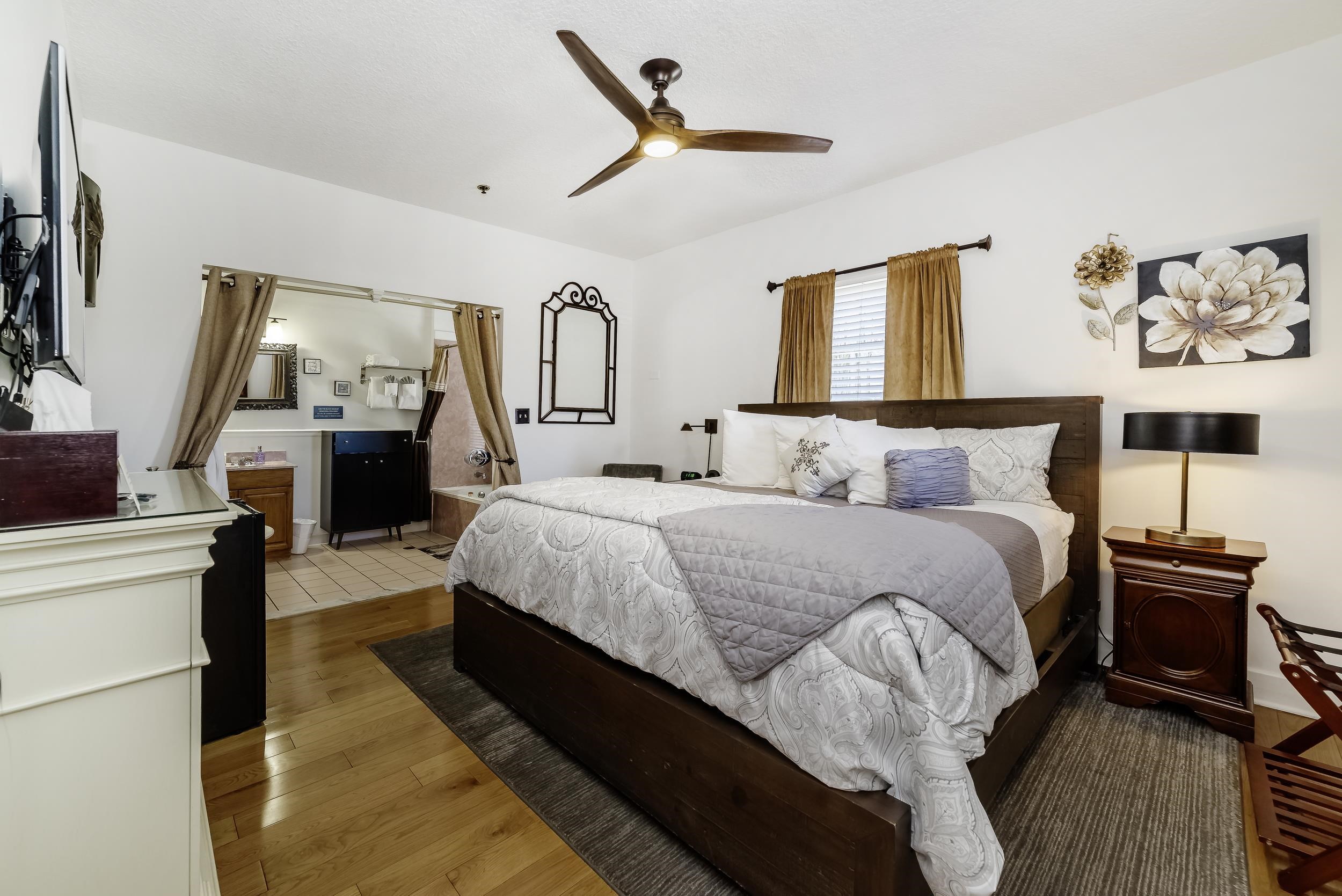 29 Cuna Street St. Augustine, FL 32084 - Photo 42 of 69 Bedroom with hardwood / wood-style floors, ceiling fan, and ensuite bath